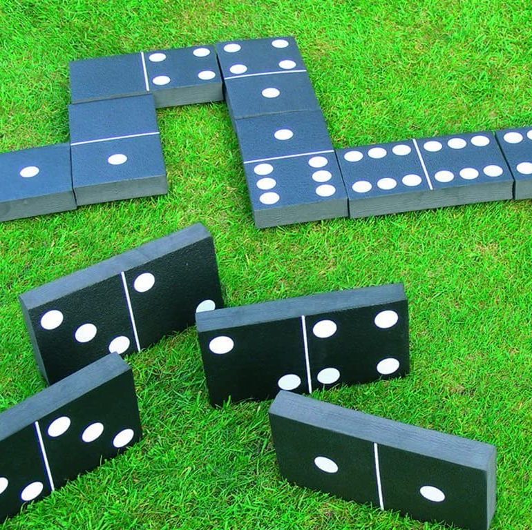 Our Giant Dominoes game set out on the grass at a summer event.