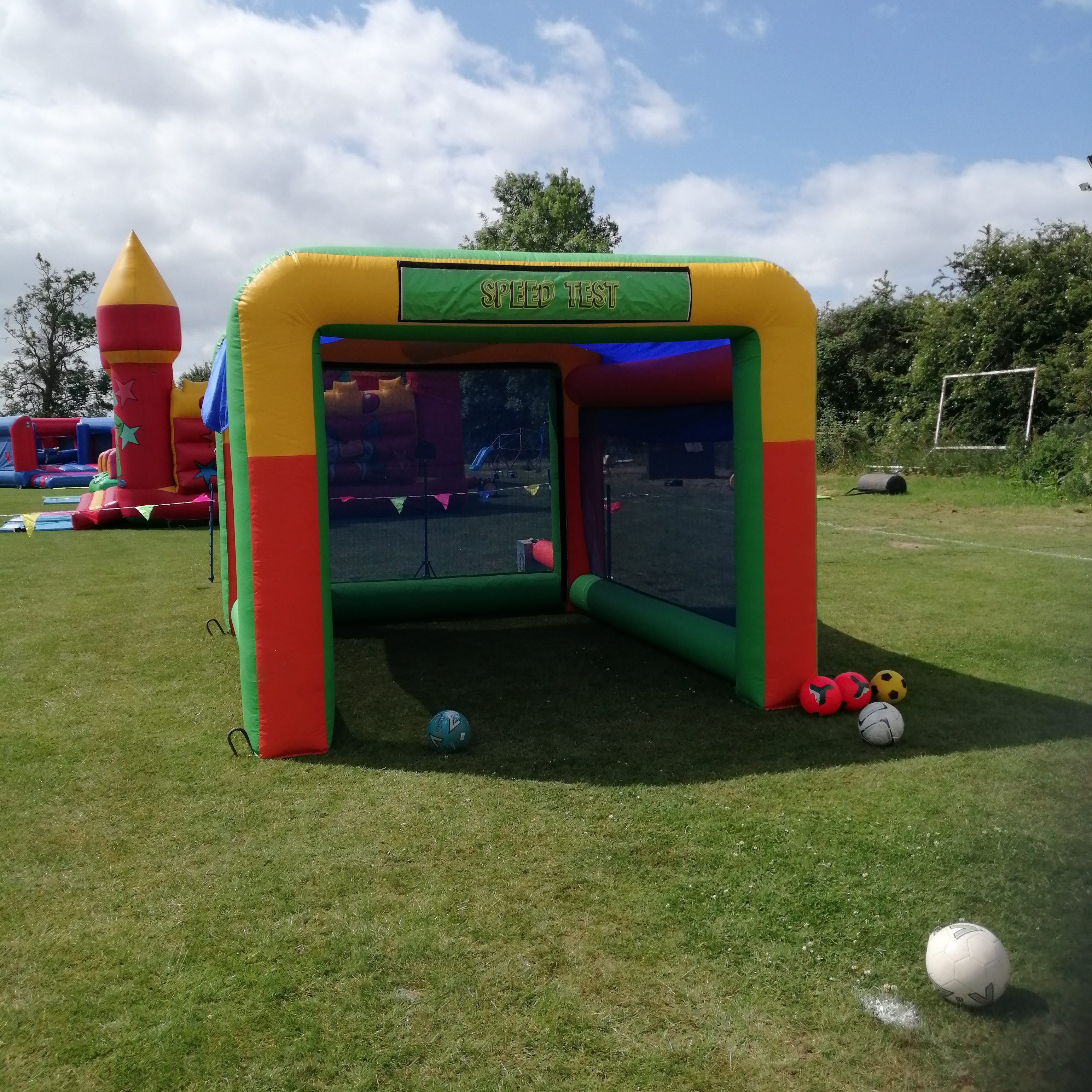 Our multi-coloured Inflatable Speed Cage set up with our speed radar gun, ready for a Sports event.