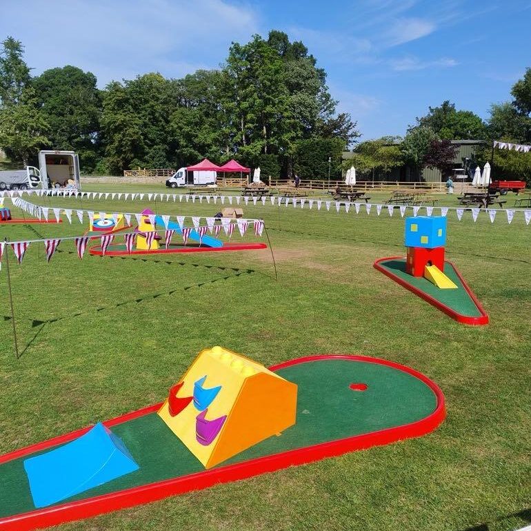 Beautifully set out Crazy Golf at a College Centenary Event.