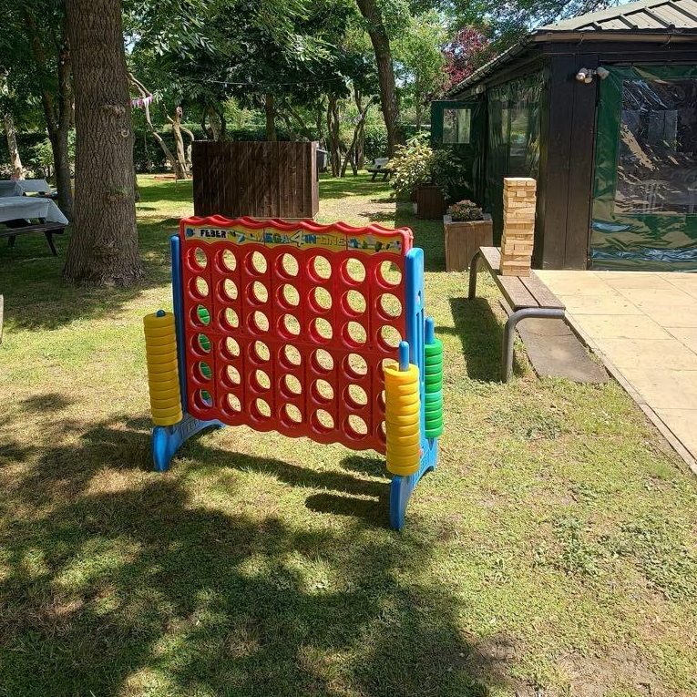 Our Giant Score 4 and other smaller Garden Fete Games set out ready for an event to begin.