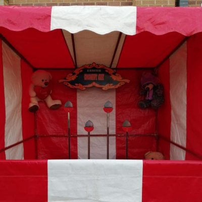 Coconut Shy Stall Our bright red and white striped Fete Game Side Stall set up with our Coconut Shy game.