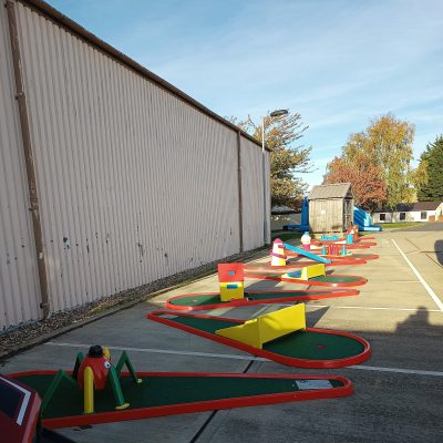 Our Crazy Golf with brightly painted obstacles set out in an office car park for a Corporate Fun Day event.