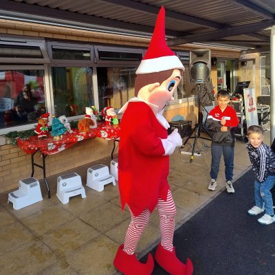 Outdoor Christmas Market with Elf Mascot